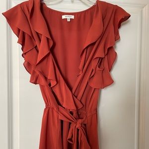 Ruffle top in burnt orange color. Size XL